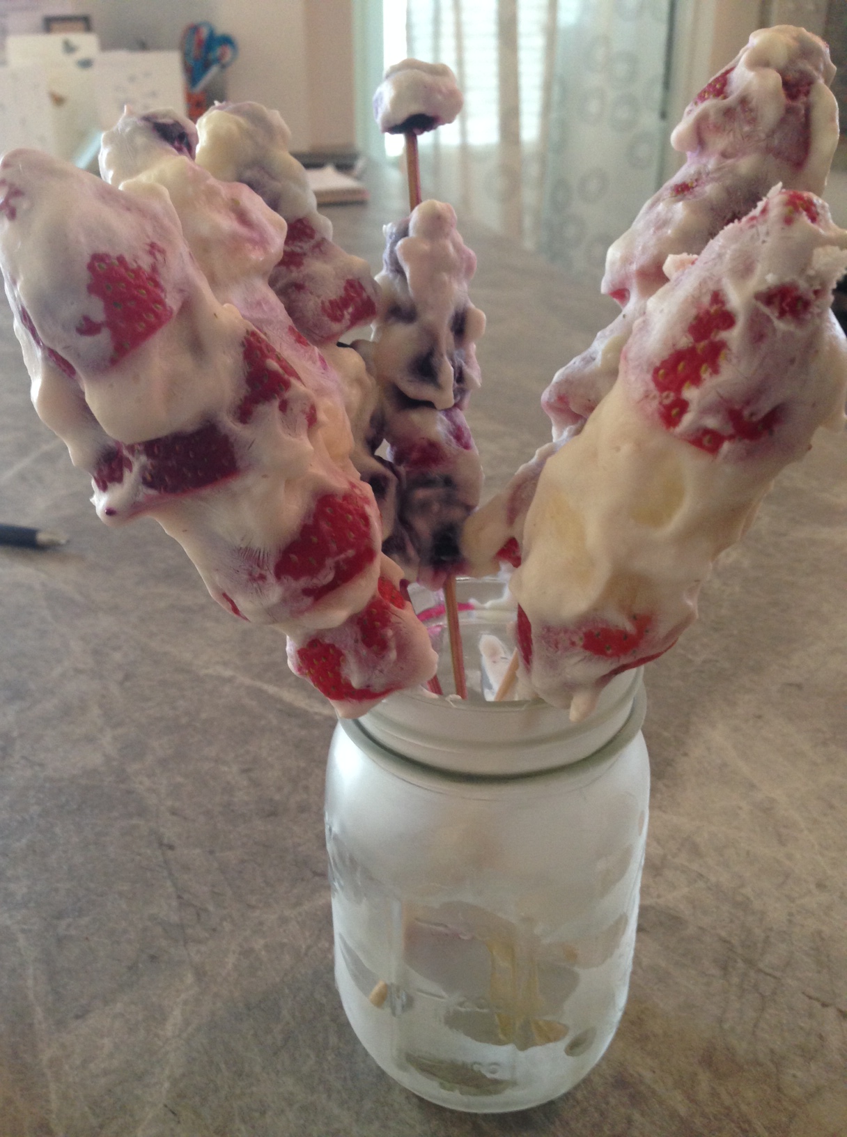 Image of frozen fruit kabobs in a mason jar