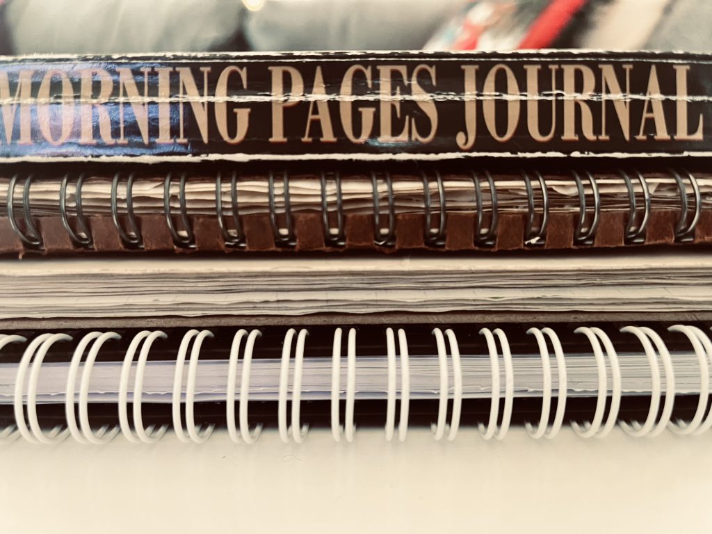 Stack of four journals.